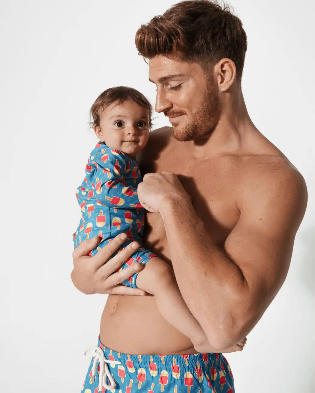 Father & Baby Ice Lolly, front view. Father and son matching swim shorts.
