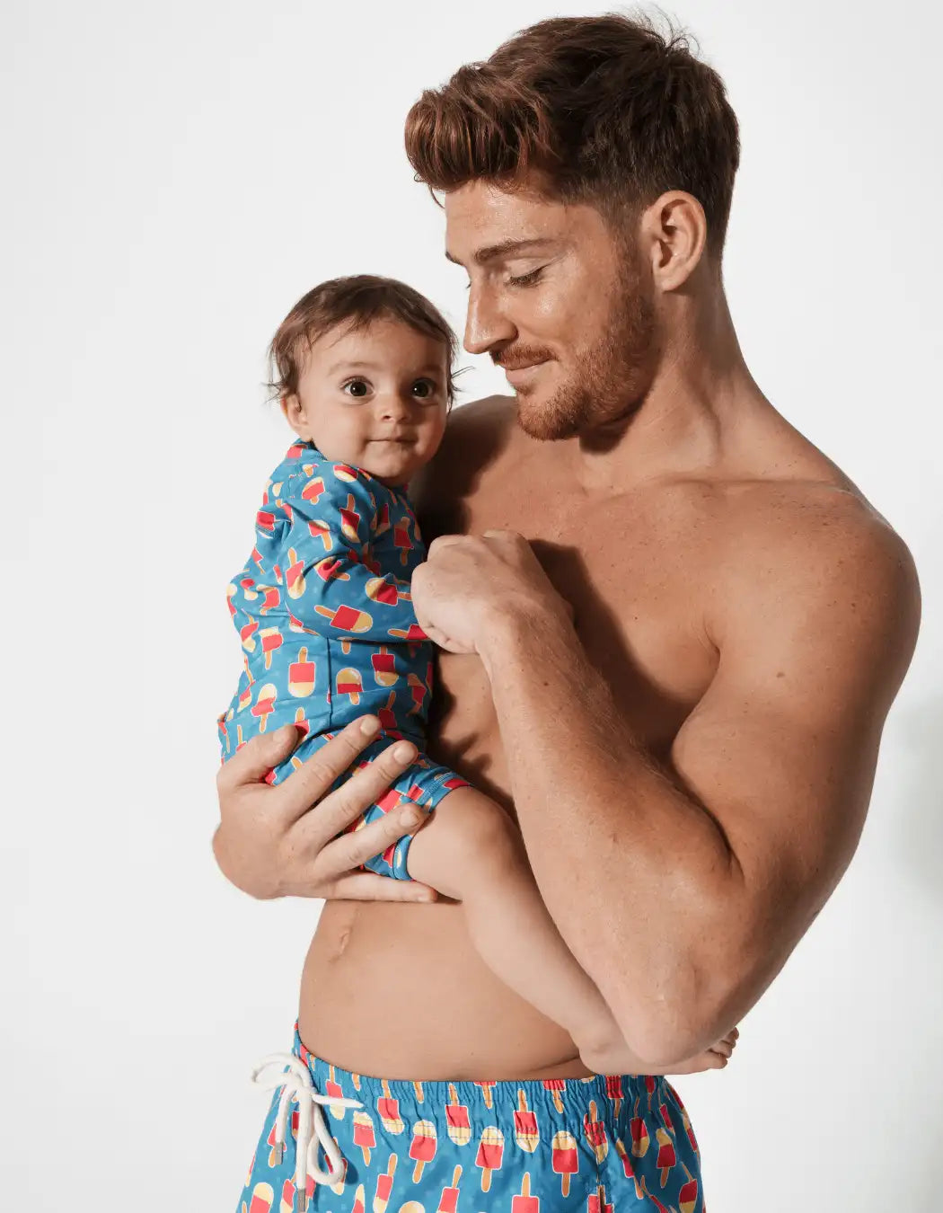 Father & Baby Ice Lolly, front view. Father and son matching swim shorts.