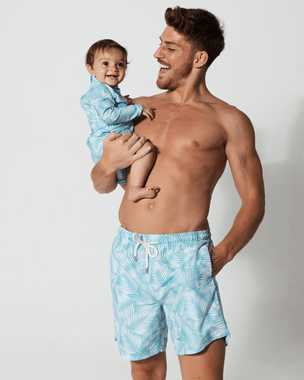 Father & Baby Green Fern, front view. Father and son matching swim shorts.