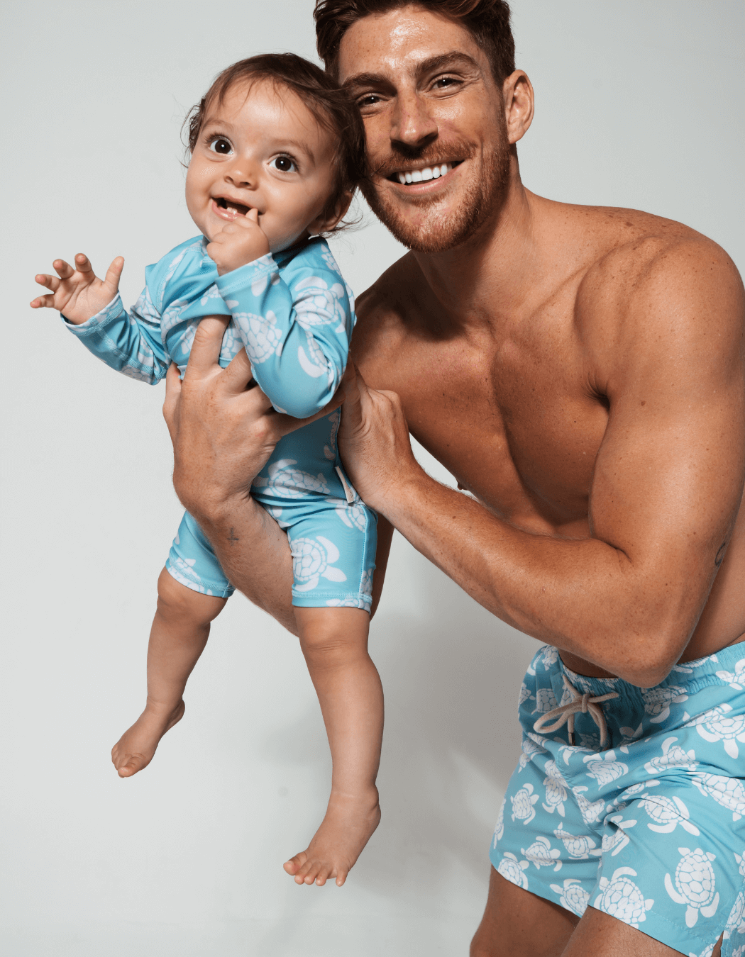Father & Baby Maldives Blue Turtle, front view. Father and son matching swim shorts.
