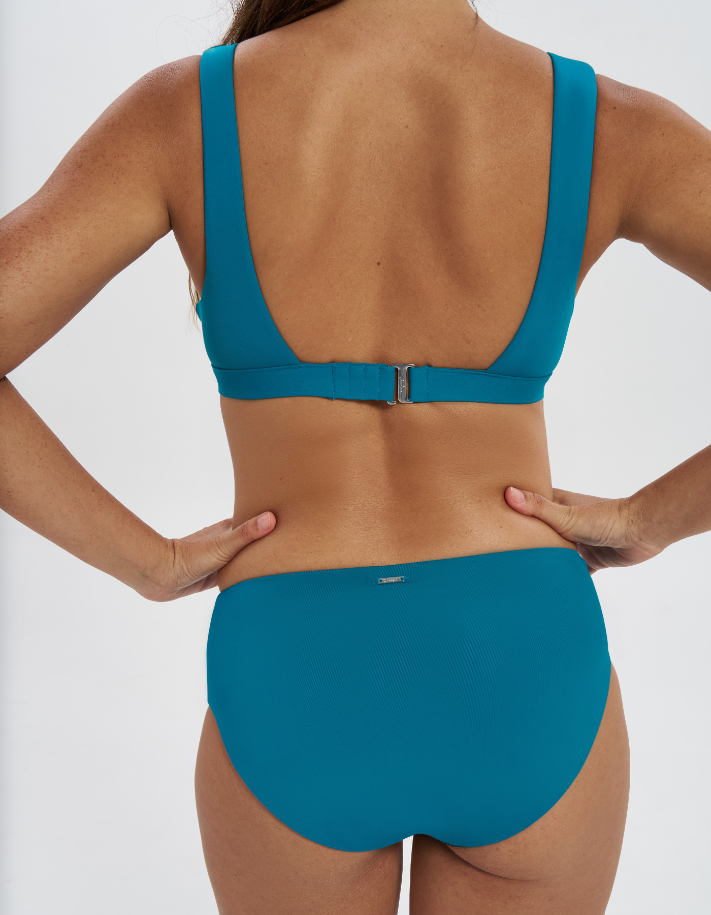 Mid Waist Teal Womens Bikini Bottoms, back view. Sustainable womens swimwear.