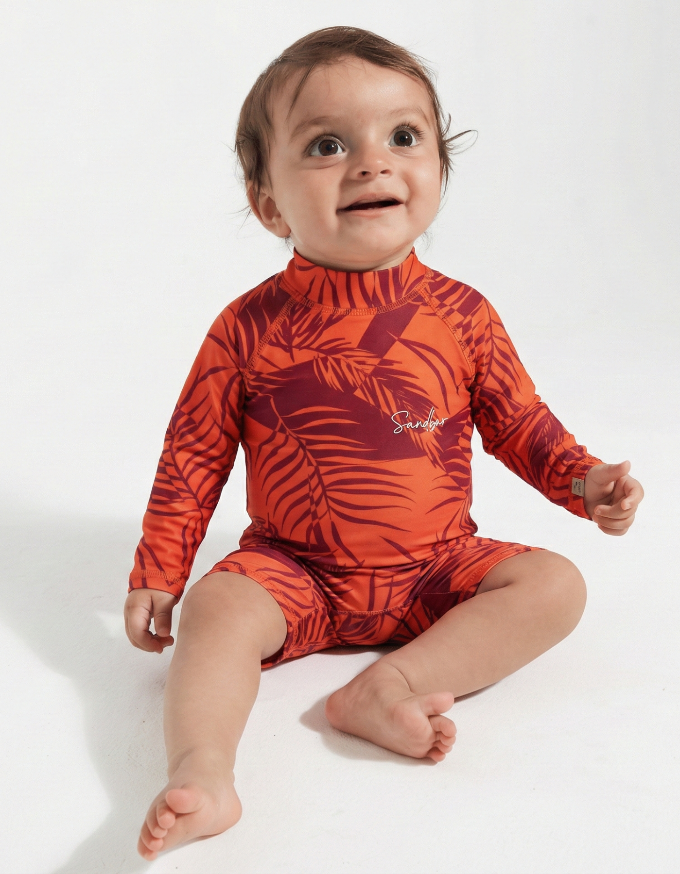 Sunset Palm Baby Swimsuit, front view. Sustainable baby swimwear.