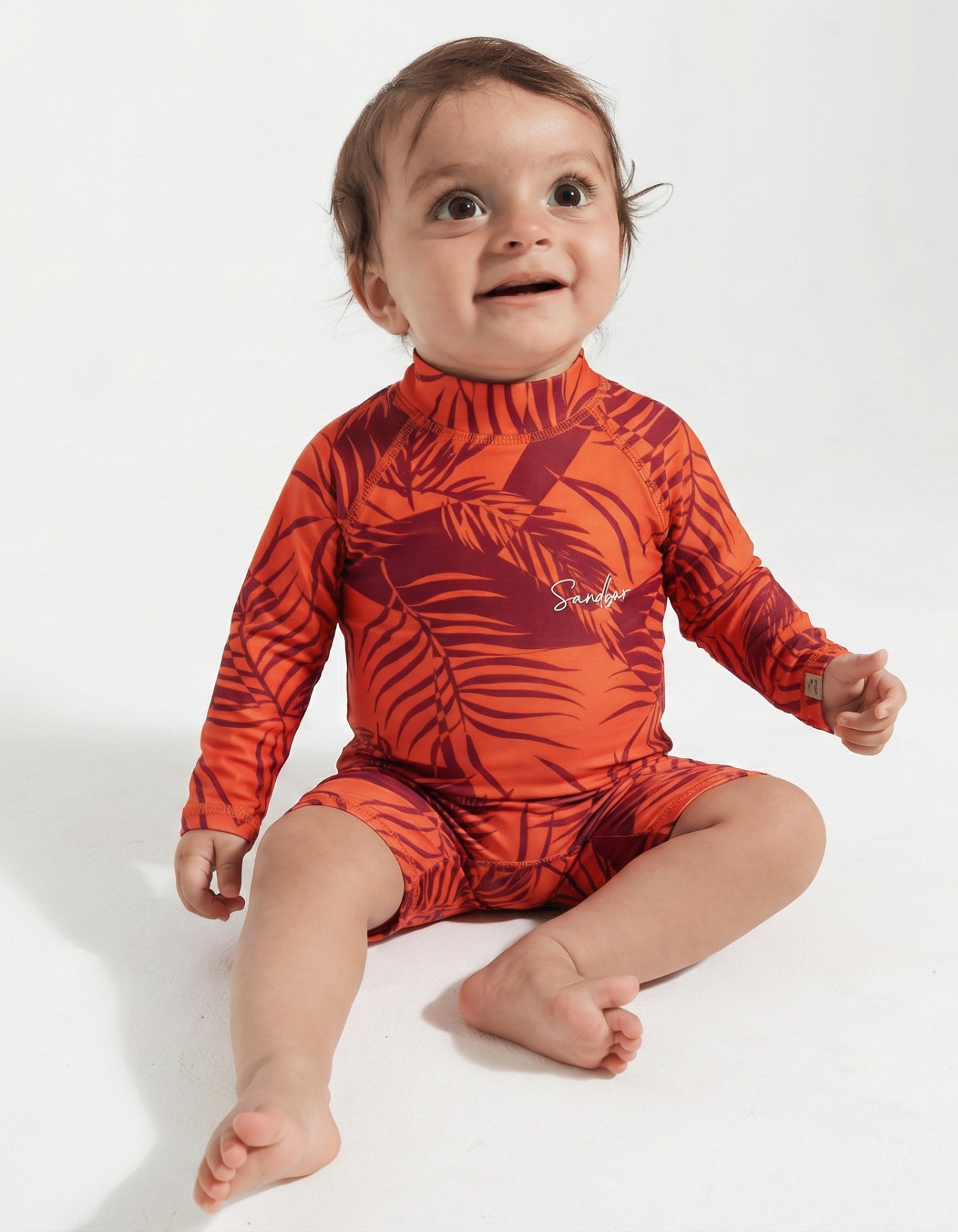 Sunset Palm Baby Swimsuit, front view. Sustainable baby swimwear.