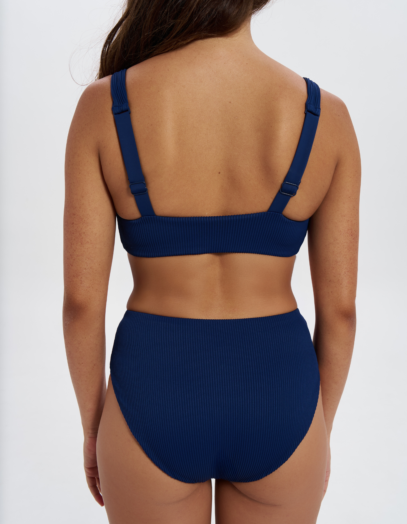 Mid Waist Midnight Blue Womens Ribbed Bikini Bottoms, back view. Sustainable womens swimwear.