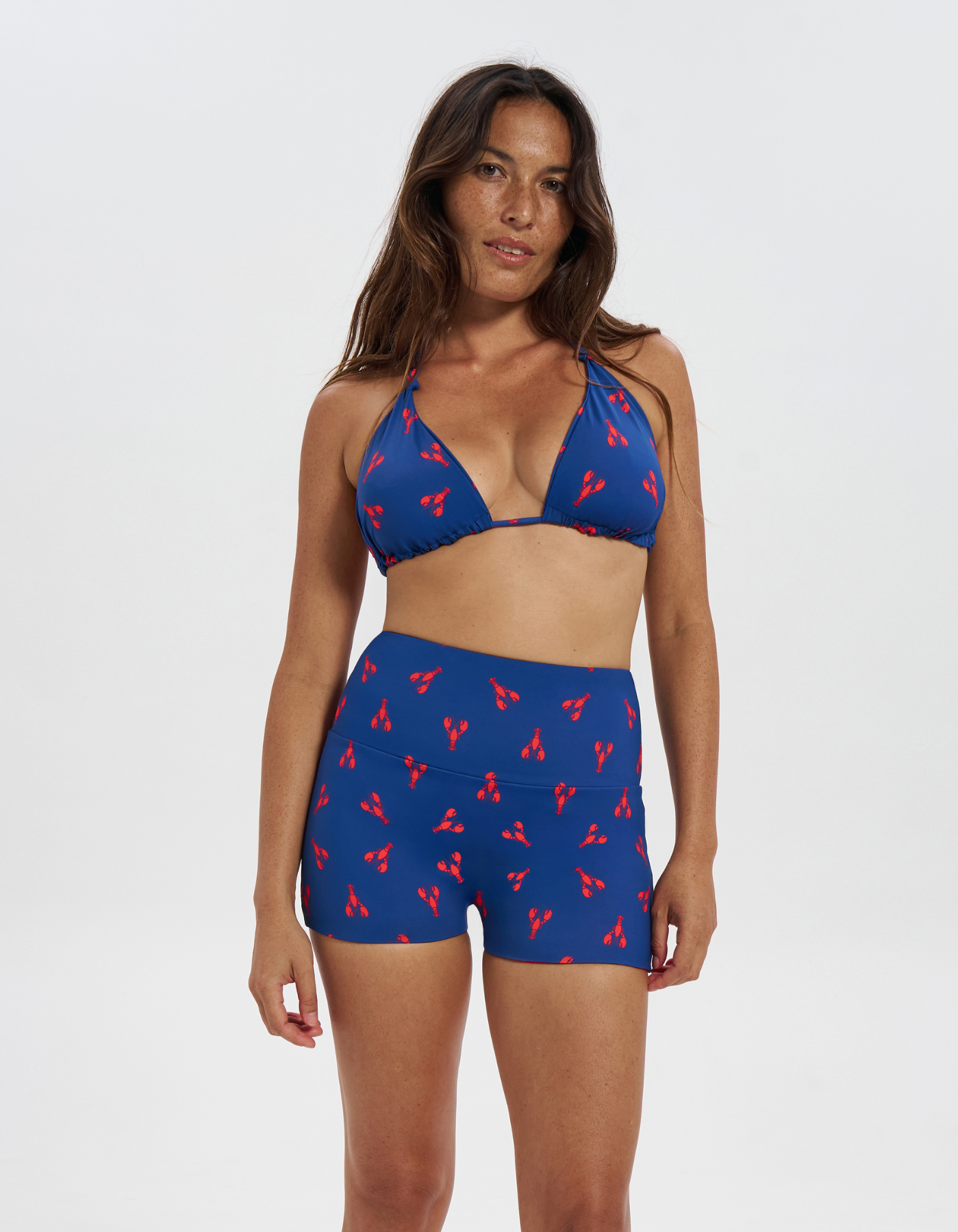 Lobster / Red Womens Reversible Swim Shorts, front view. Sustainable womens swimwear.