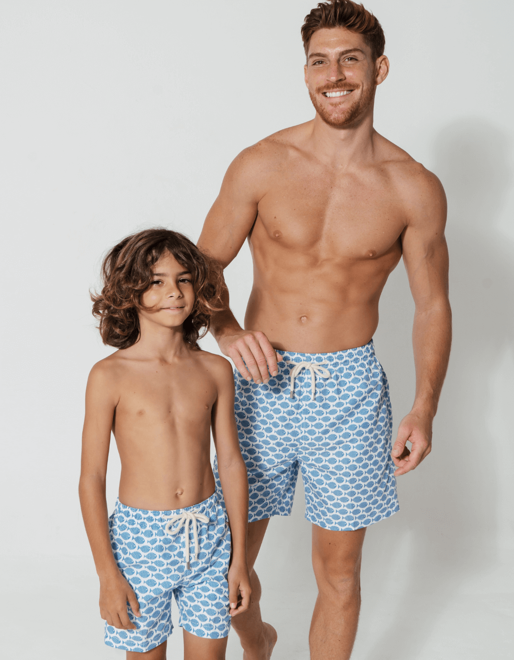 Father & Son Swim Shorts Baby Blue Fish, front view. Father and son matching swim shorts.