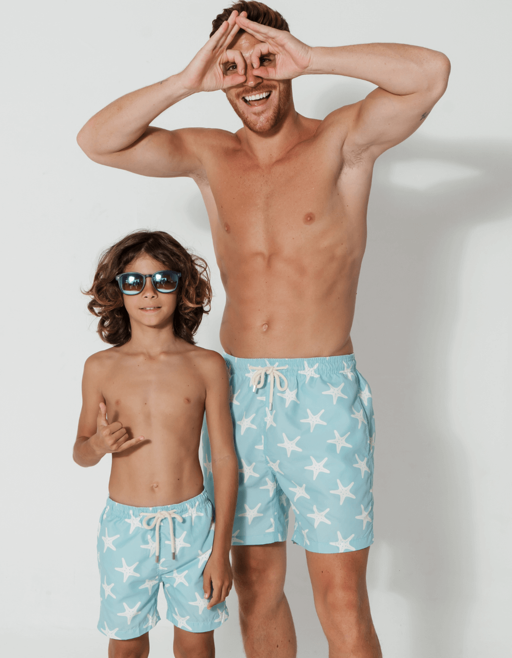 Father & Son Swim Shorts Blue Starfish, front view. Father and son matching swim shorts.
