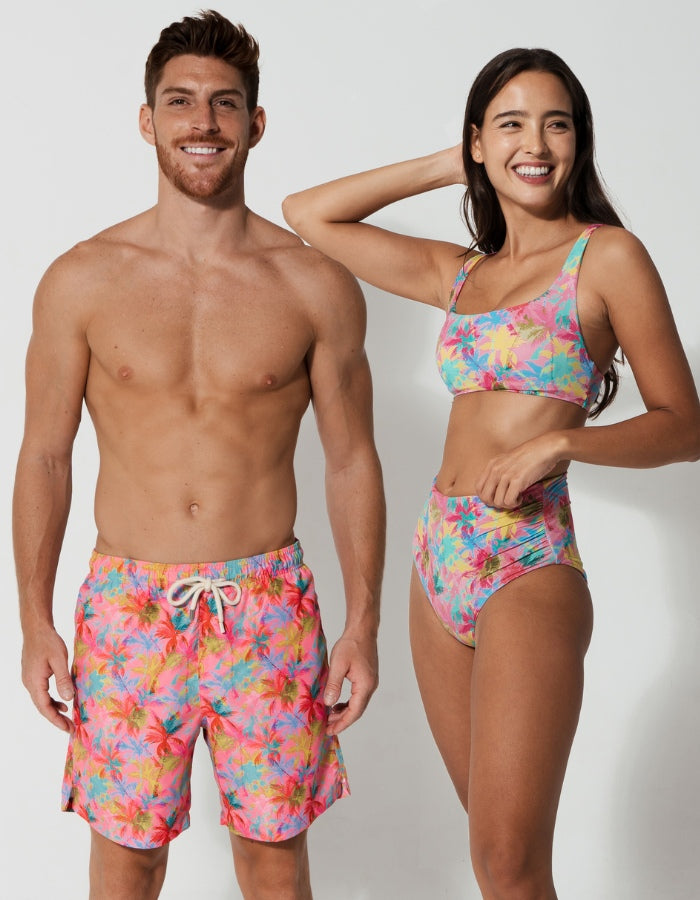His & Hers Pink Palm, front view. Family matching swimwear.