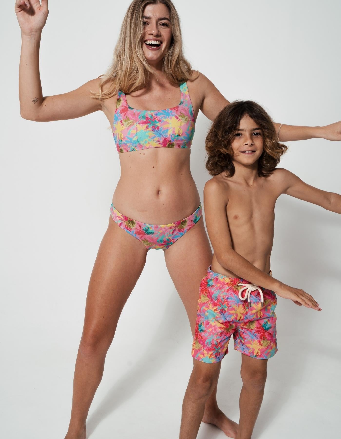 Mother & Son Pink Palm, front view. Mother and son matching swimwear.