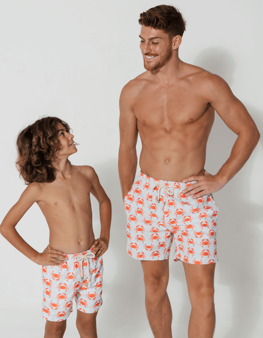Father & Son Swim Shorts Peach Crab, front view. Father and son matching swim shorts.