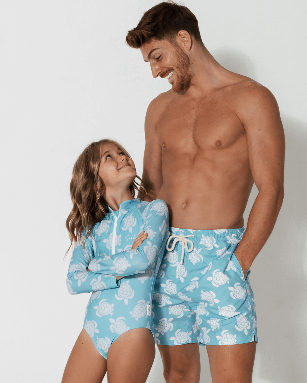 Father & Daughter Maldives Blue Turtle, front view. Father and son matching swim shorts.