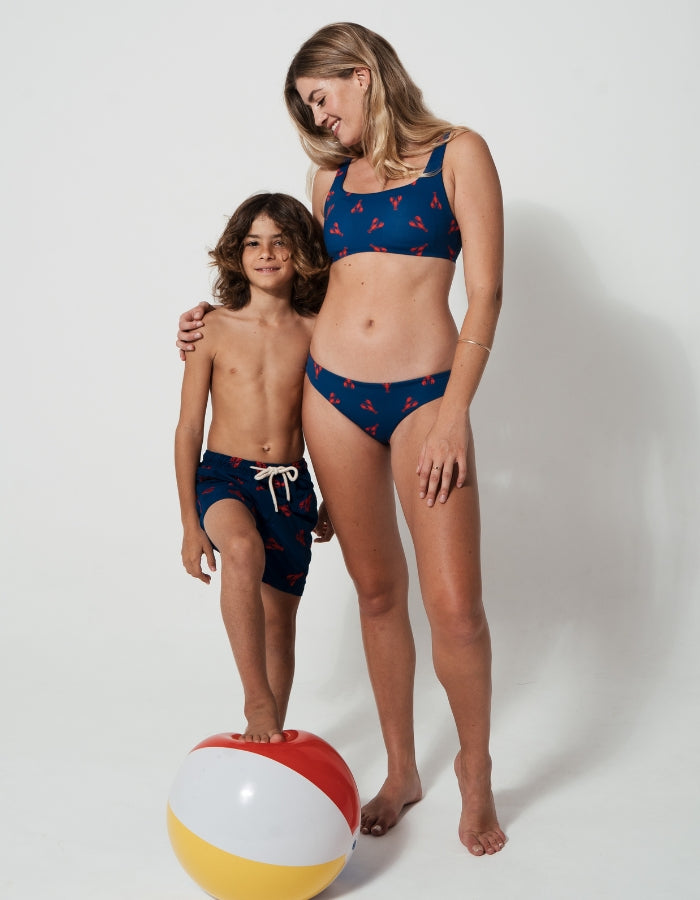 Mother & Son Red Lobster, back view. Mother and son matching swimwear.