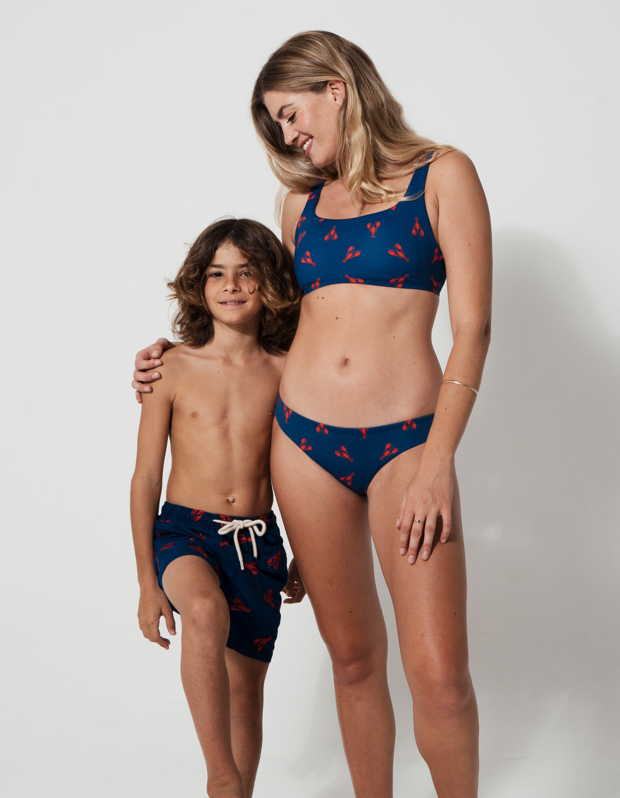 Embroidered Red Lobster Boys Swim Shorts, lifestyle shot. Embroidered kids swim shorts.