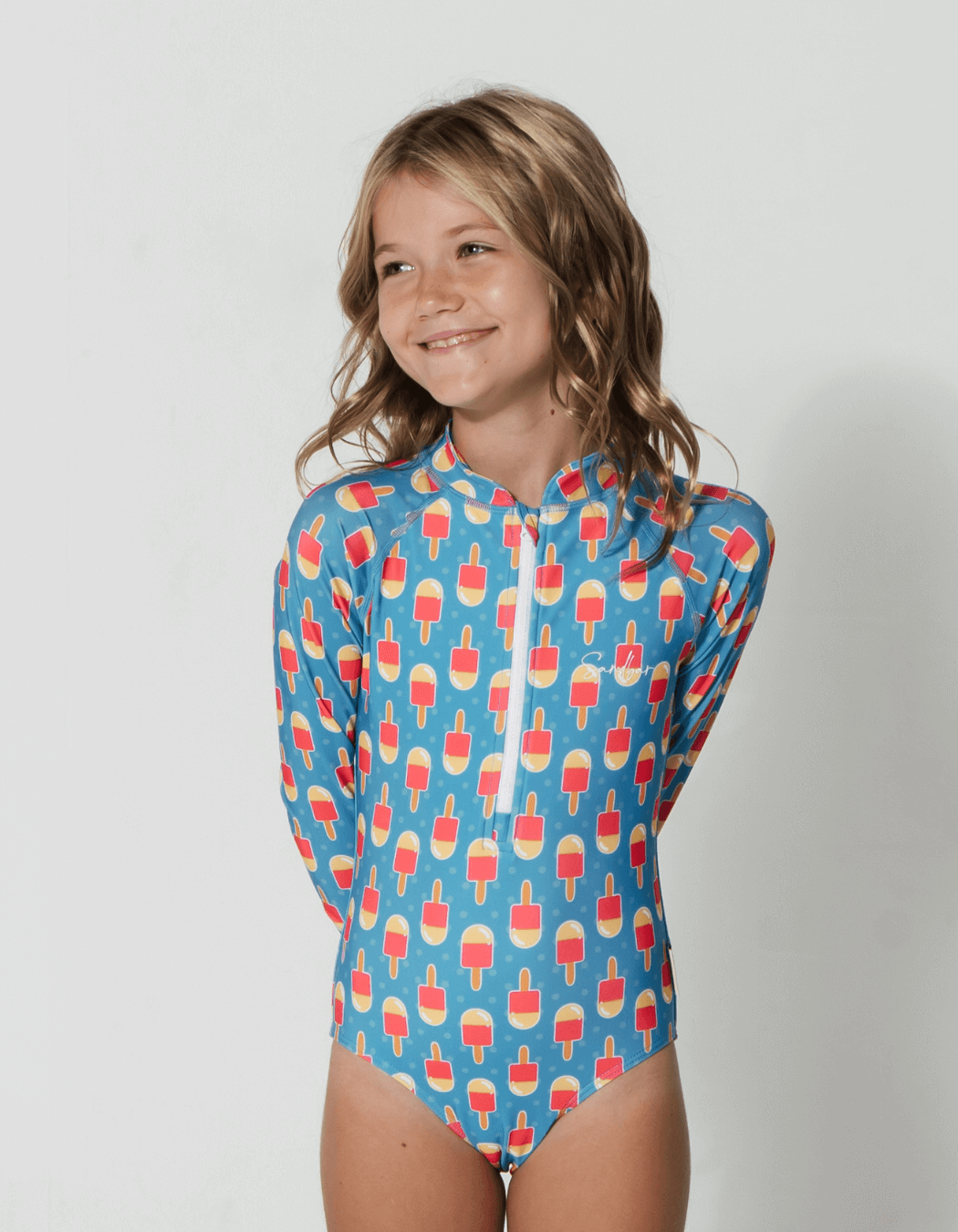 Father & Daughter Ice Lolly, back view. Father and son matching swim shorts.