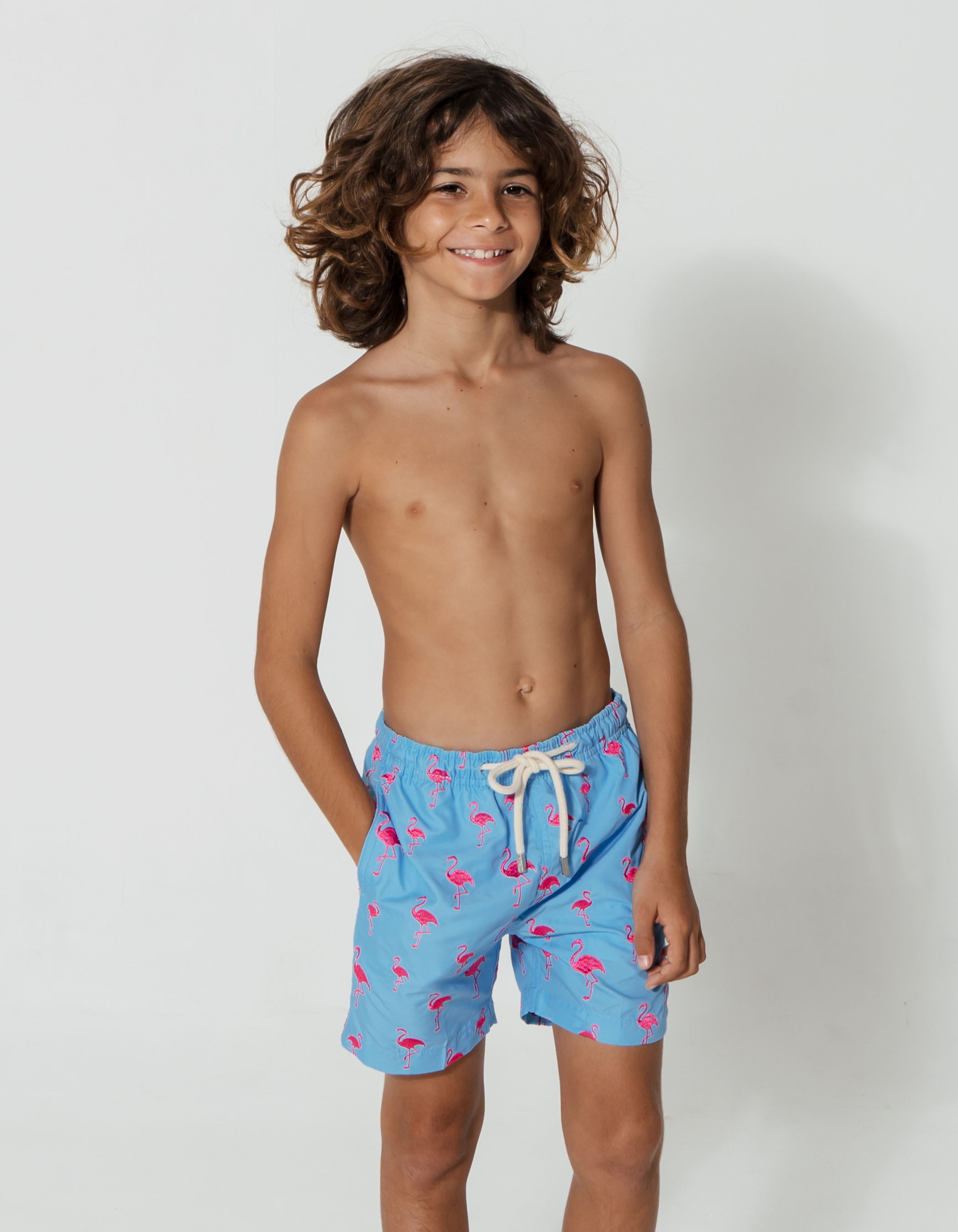 Embroidered Pink Flamingo Boys Swim Shorts, front view. Embroidered kids swim shorts.