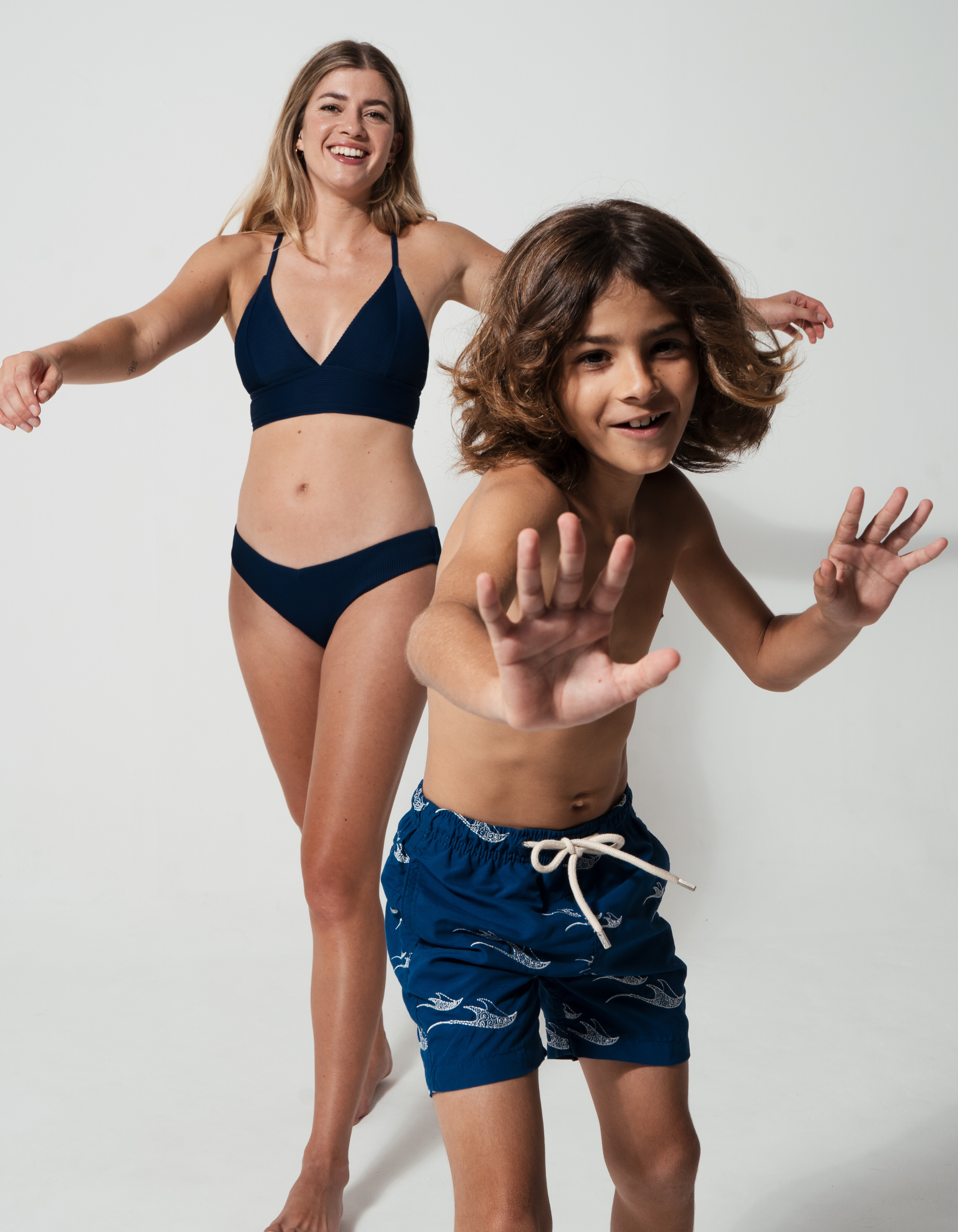 Embroidered Manta Boys Swim Shorts, lifestyle shot. Embroidered kids swim shorts.