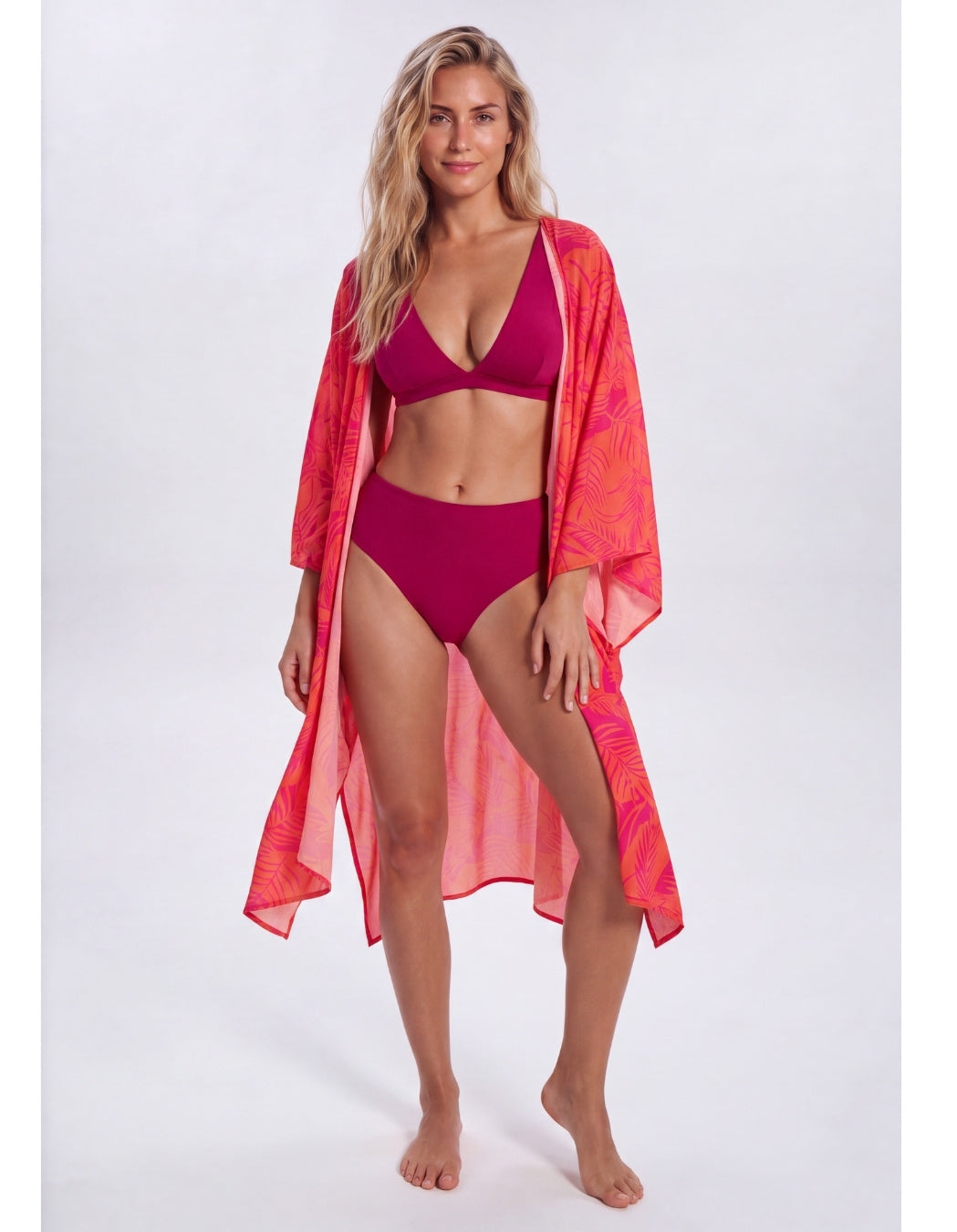 Aperol Palm caftan worn over a plum bikini, full-length view