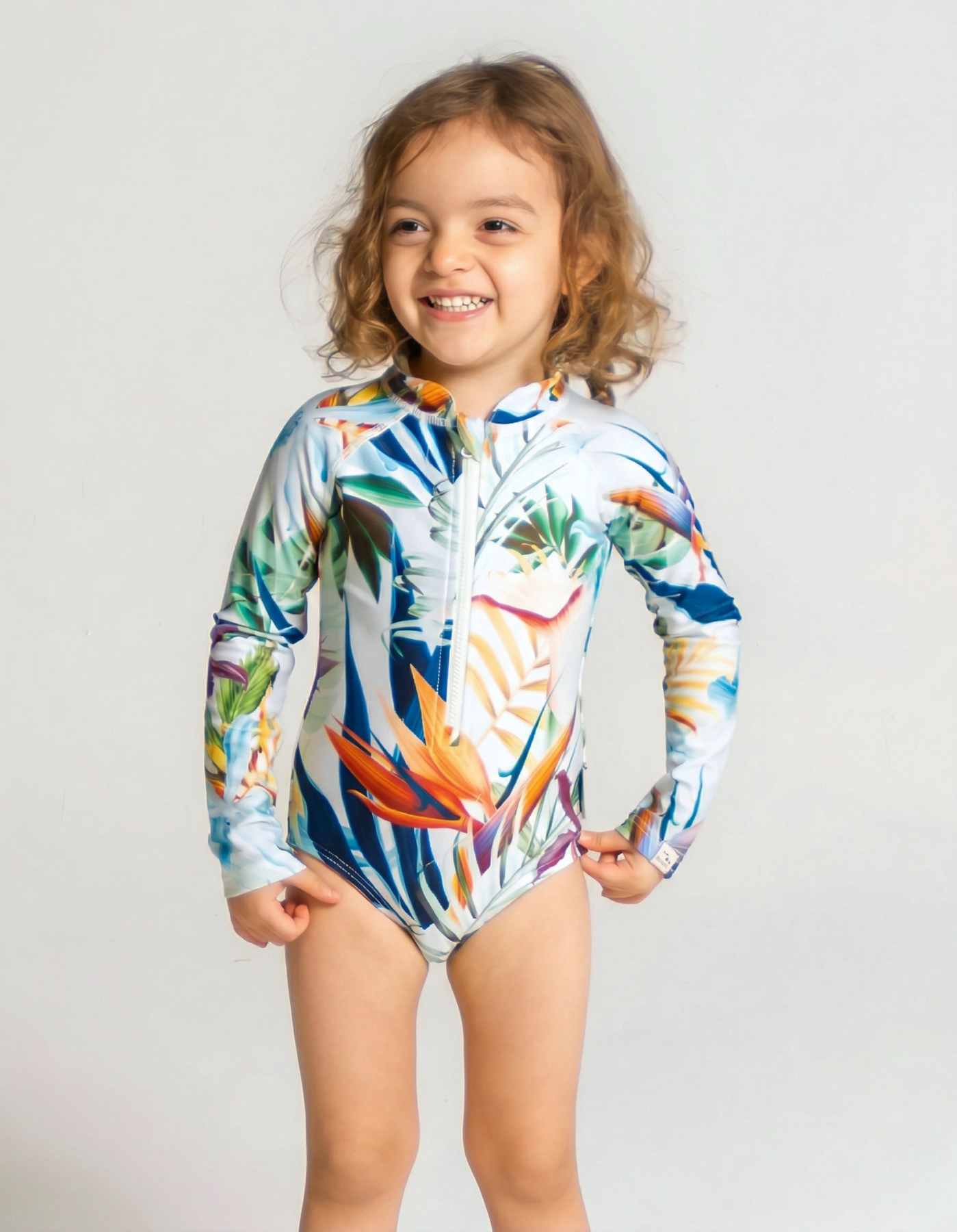 Bird of Paradise Long Sleeved Girls Swimsuit, front view. Sustainable girls swimwear.