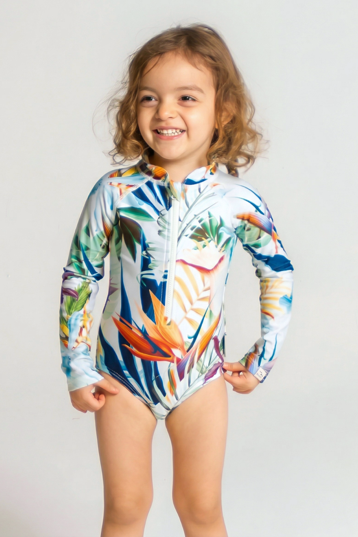 Bird of Paradise Long Sleeved Girls Swimsuit, front view. Sustainable girls swimwear.