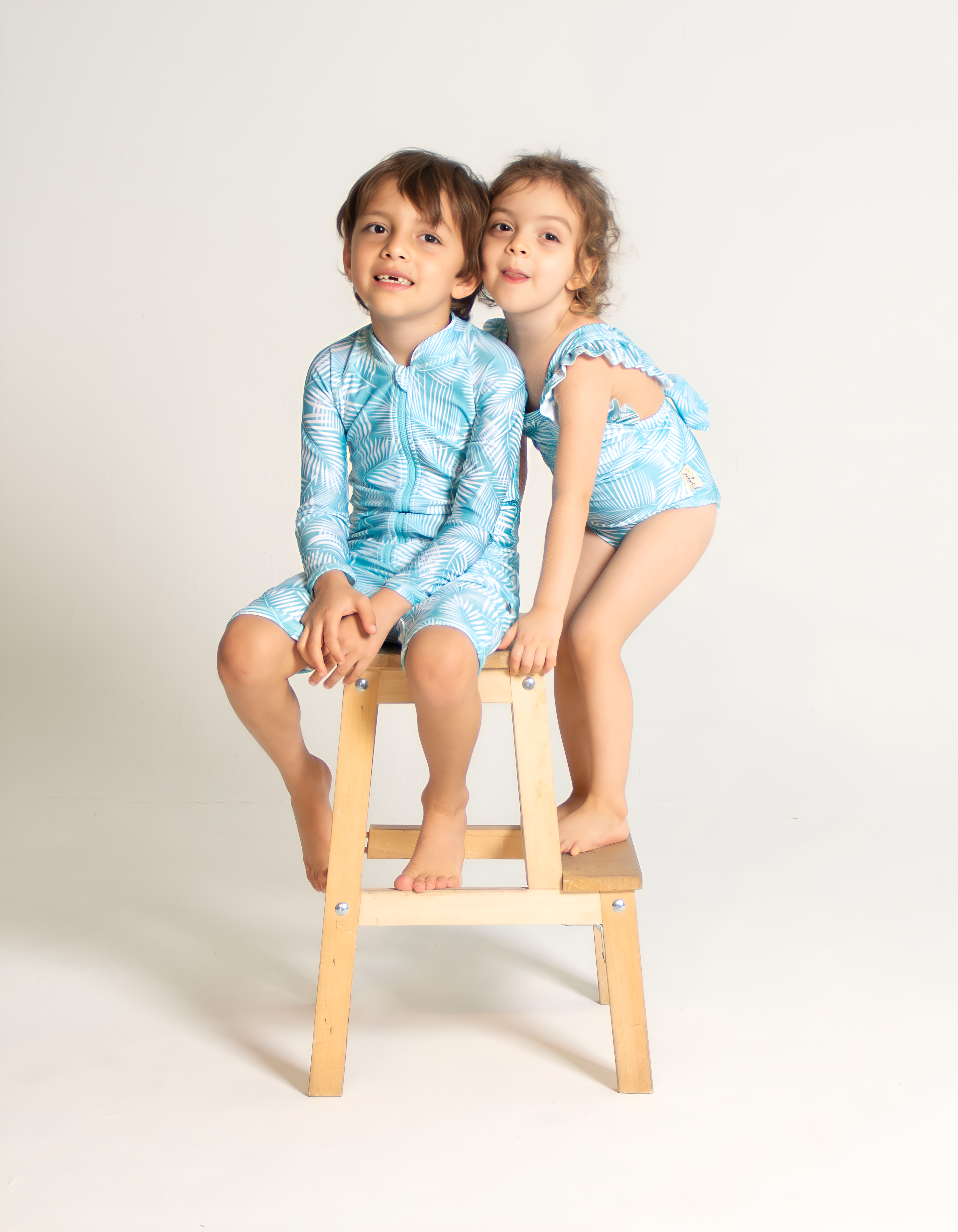 Green Fern Kids Body Suit, front view. Sustainable kids swimwear.