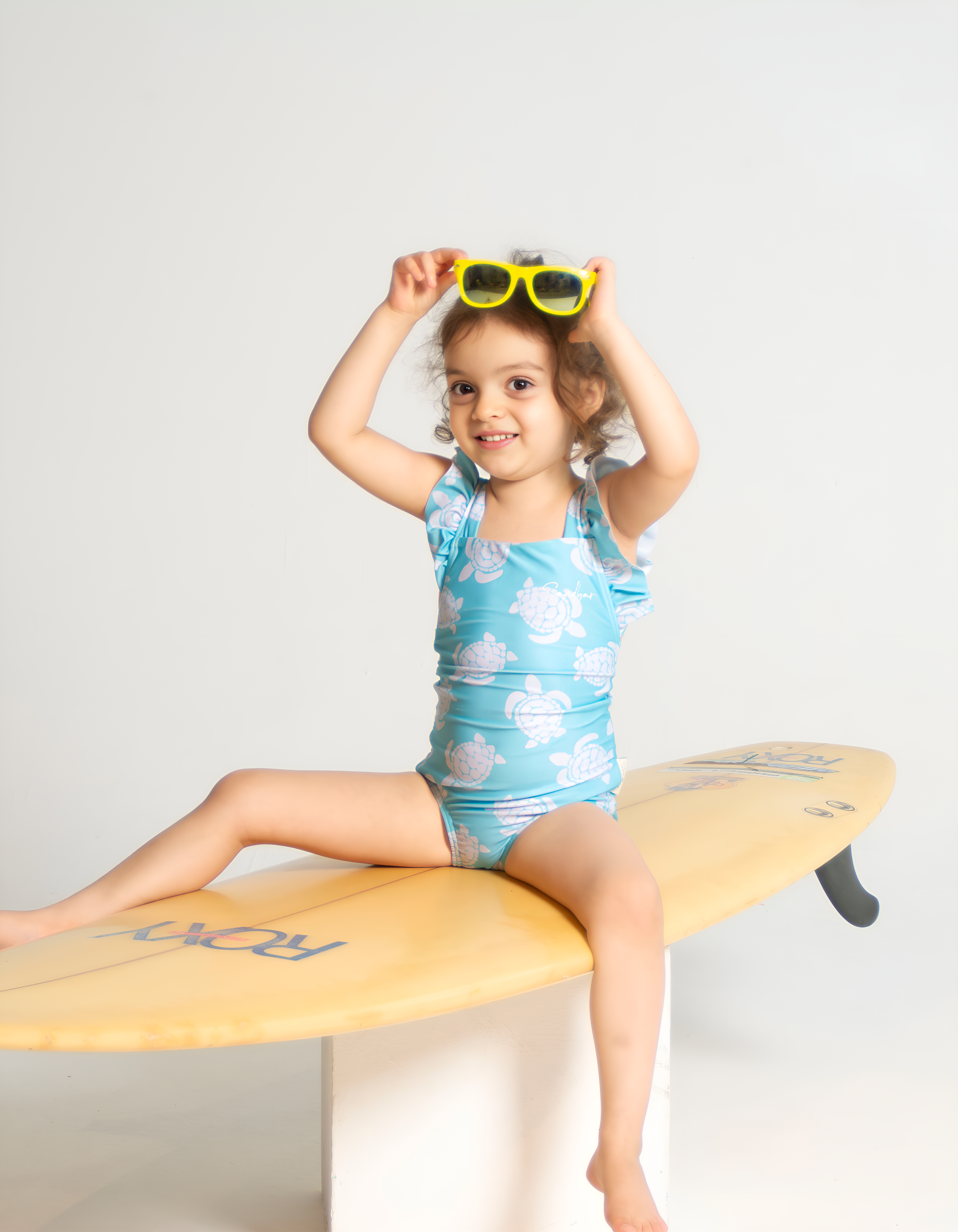 Maldives Blue Turtle Girls Ruffle Swimsuit, front view. Sustainable girls swimwear.