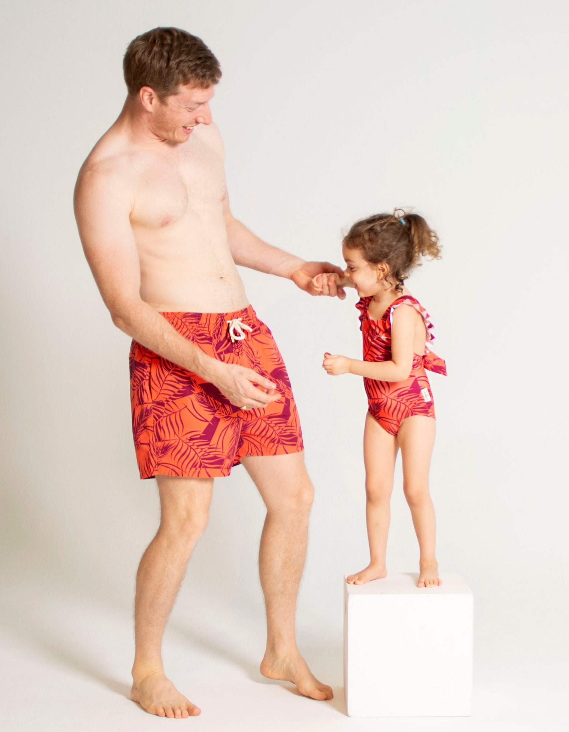 Sunset Palm Girls Ruffle Swimsuit, front view. Sustainable girls swimwear.