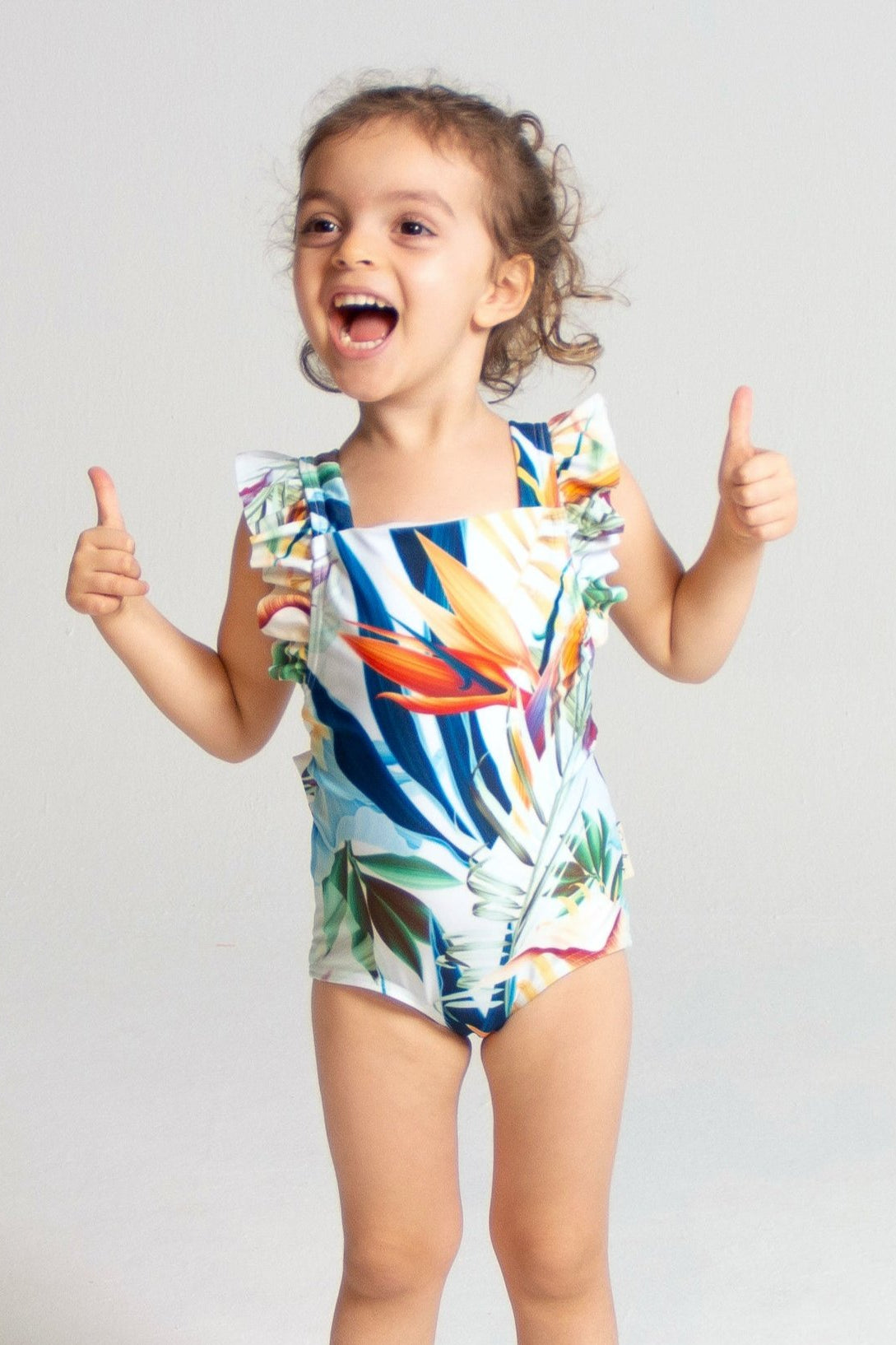 Bird of Paradise Girls Ruffle Swimsuit, front view. Sustainable girls swimwear.
