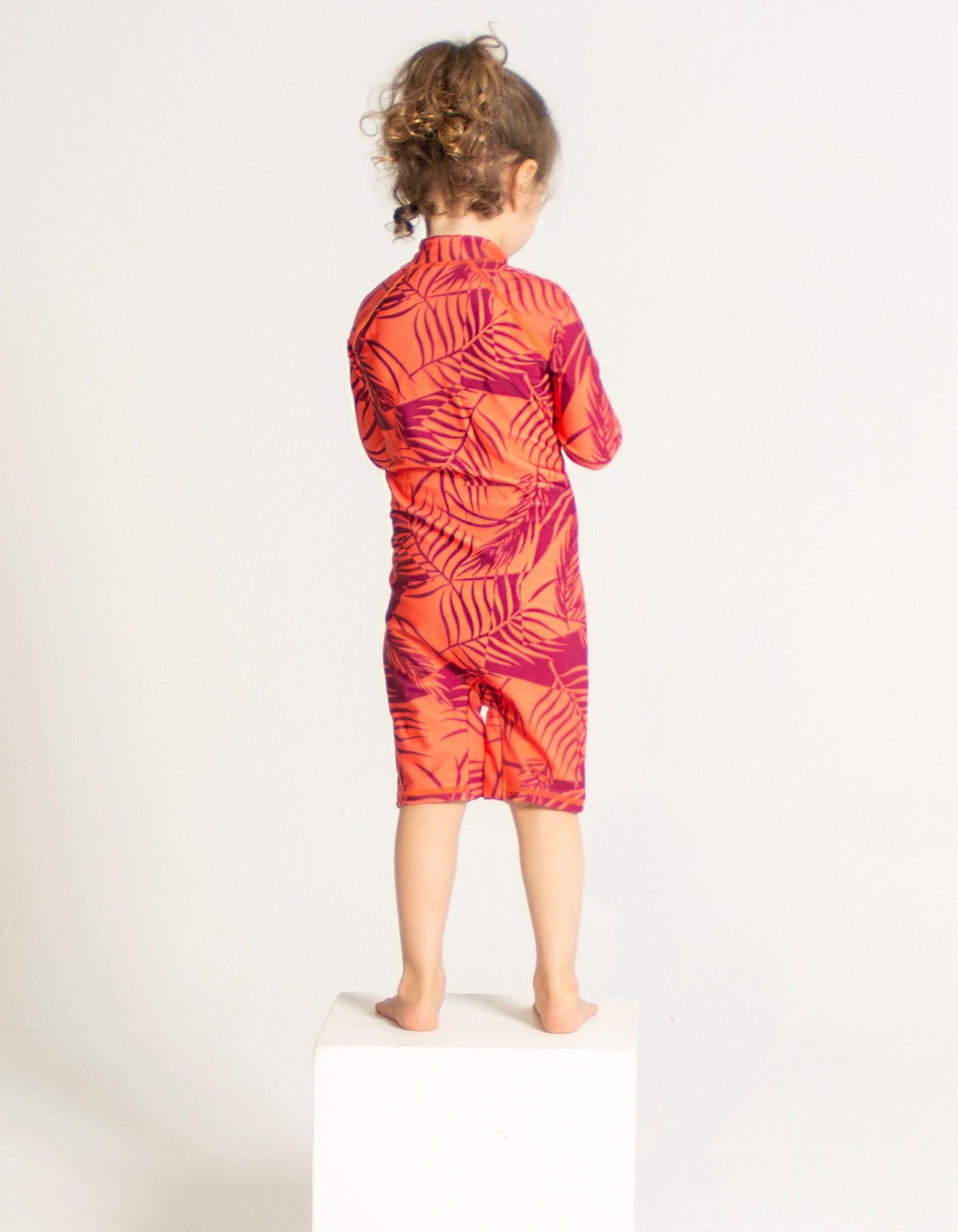 Sunset Palm Kids Body Suit, back view. Sustainable kids swimwear.