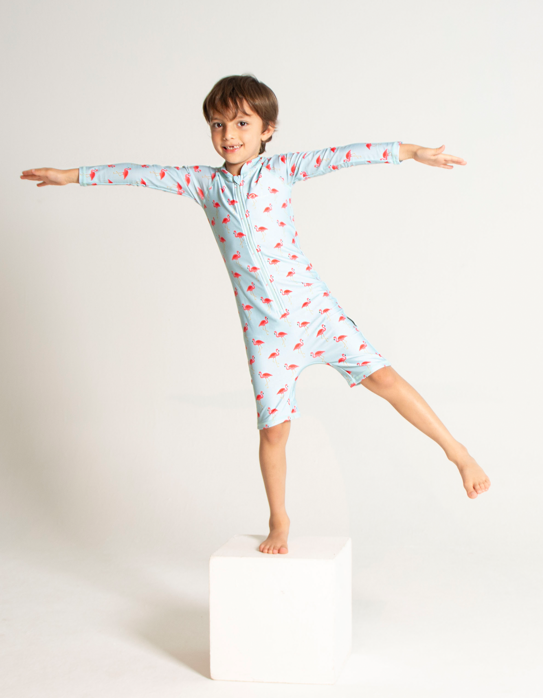 Pink Flamingo Kids Body Suit, front view. Sustainable kids swimwear.