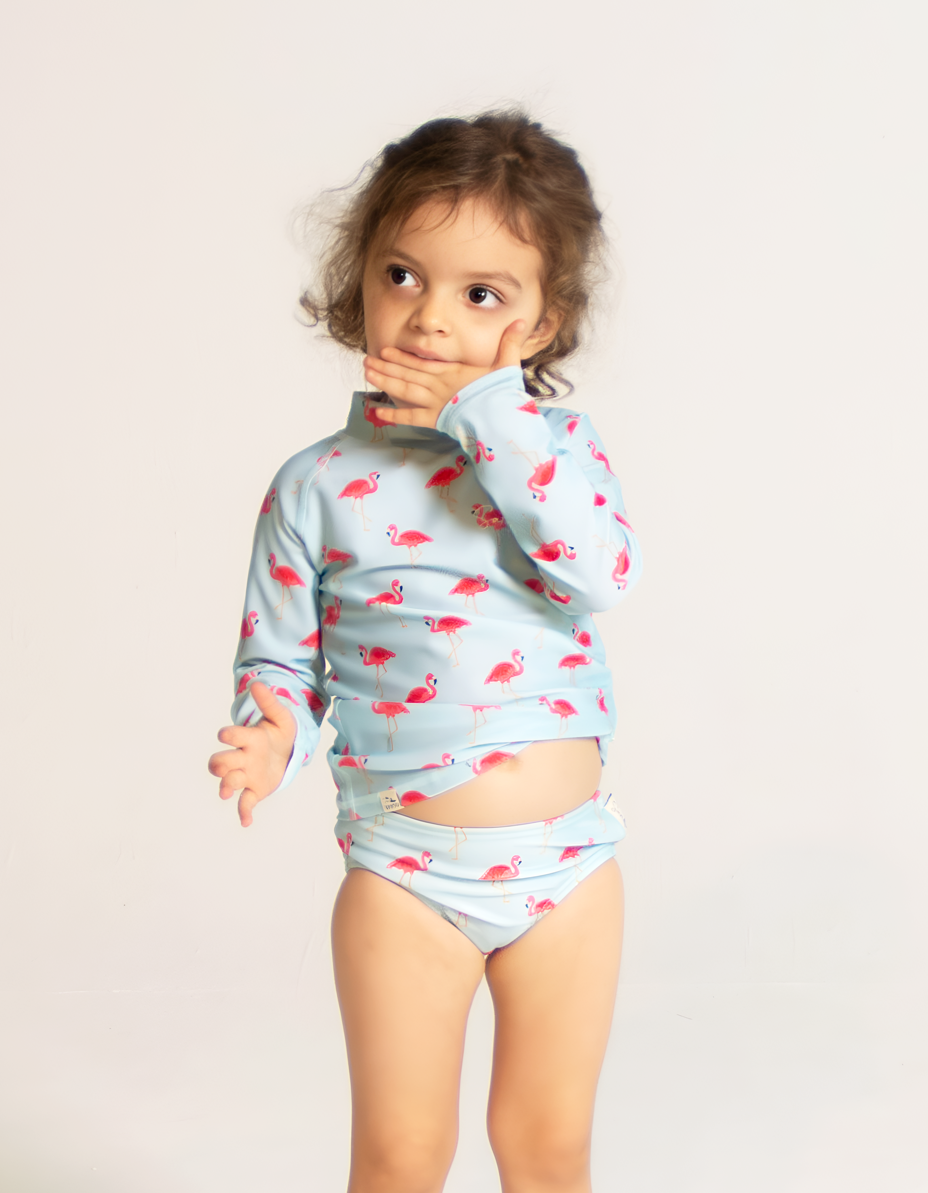 Pink Flamingo Girls Bikini Bottoms, front view. Sustainable girls swimwear.
