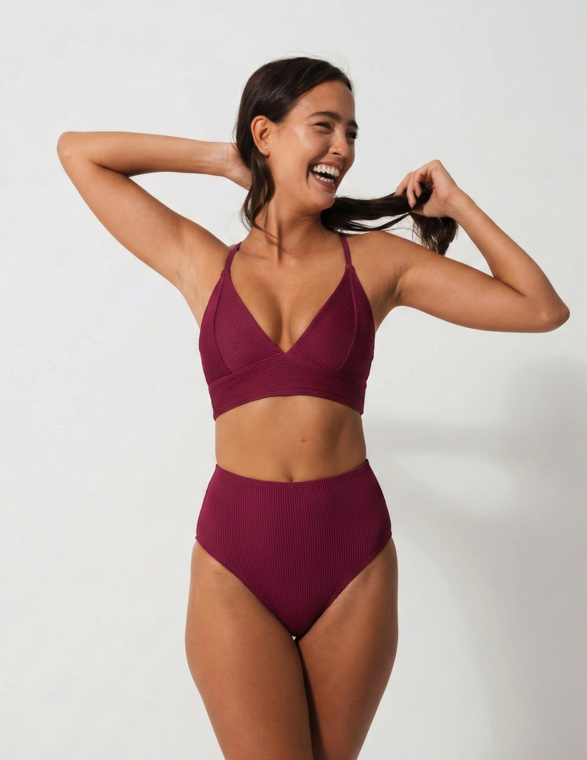 Flores Plum Womens Ribbed Plunge Bikini Top, lifestyle shot. Sustainable womens swimwear.