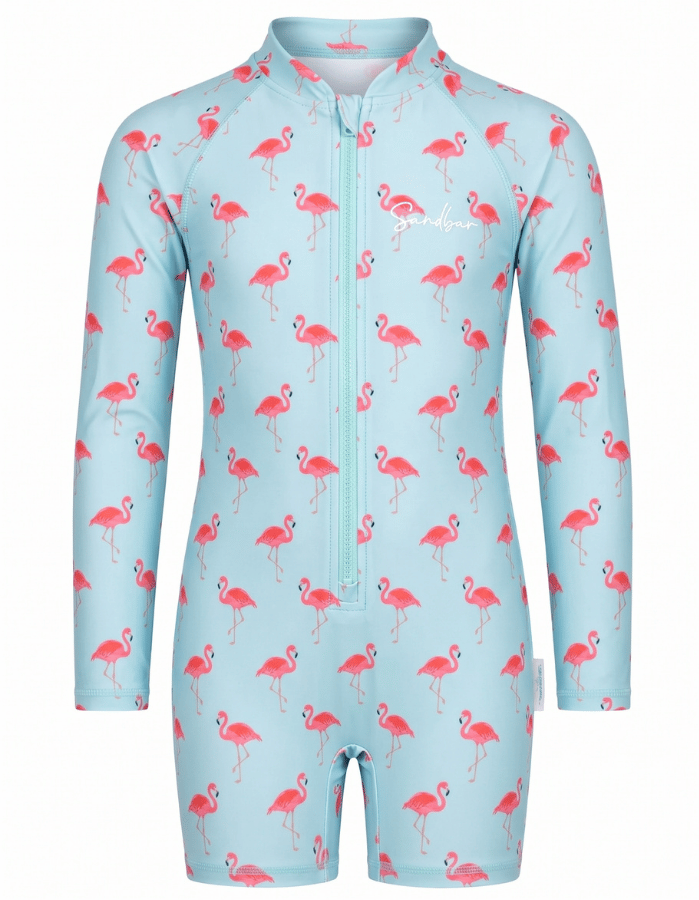 A long-sleeve, short-legged children's swim suit in light blue with a pink flamingo pattern, featuring a front zipper and a white script logo on the chest.