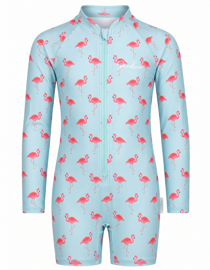 A long-sleeve, short-legged children's swim suit in light blue with a pink flamingo pattern, featuring a front zipper and a white script logo on the chest.