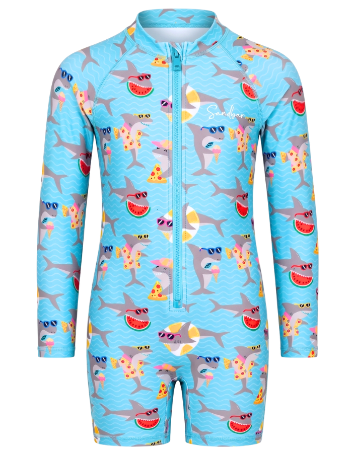 A kids' long-sleeve full-zip swimsuit in light blue, featuring an all-over cartoon print of gray sharks wearing sunglasses, eating watermelon slices, and pizza slices. The brand name 'Sunnyde' is printed in white script on the upper chest.