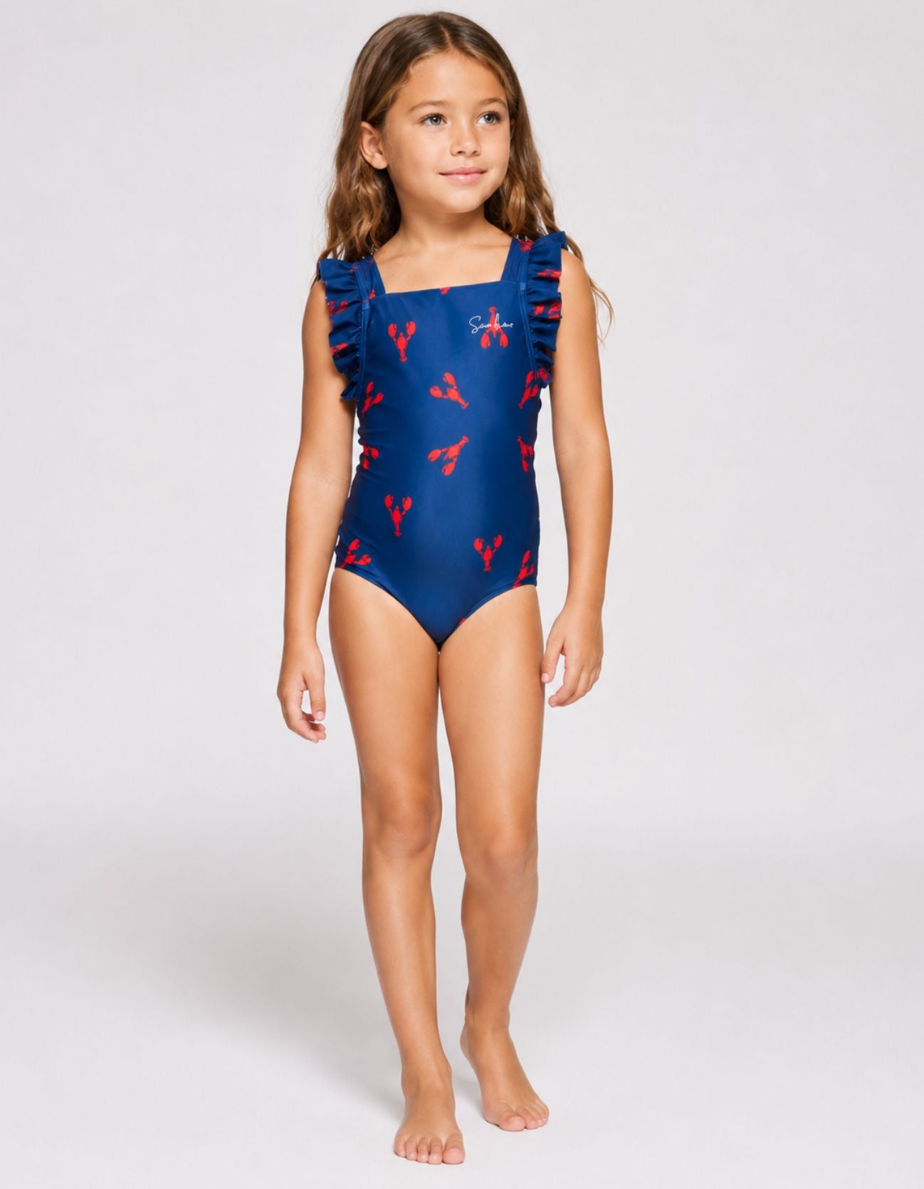 Red Lobster Girls Ruffle Swimsuit, front view. Sustainable girls swimwear.