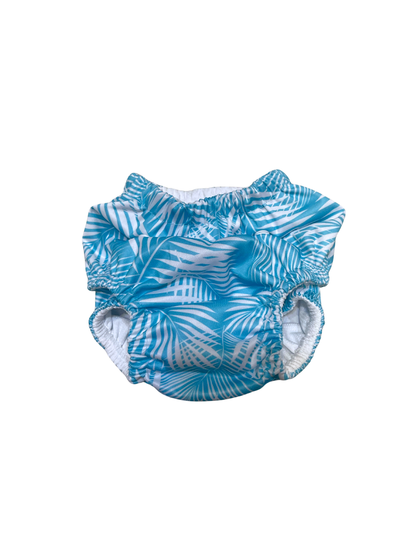 Green Fern Reusable Swim Diaper, lifestyle shot. Reusable swim diaper.