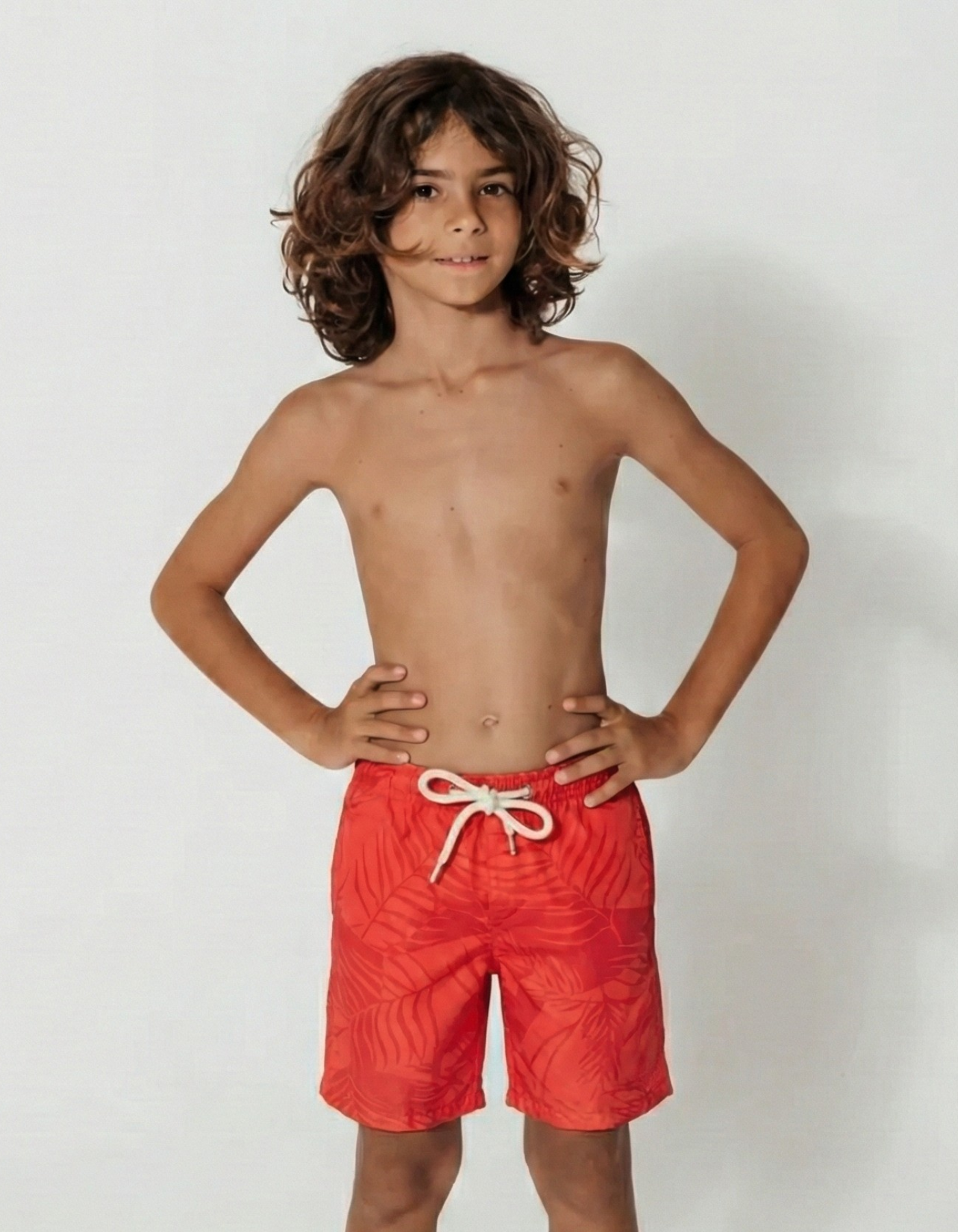 Aperol Palm Boys Swim Shorts, front view. Sustainable boys swimwear.