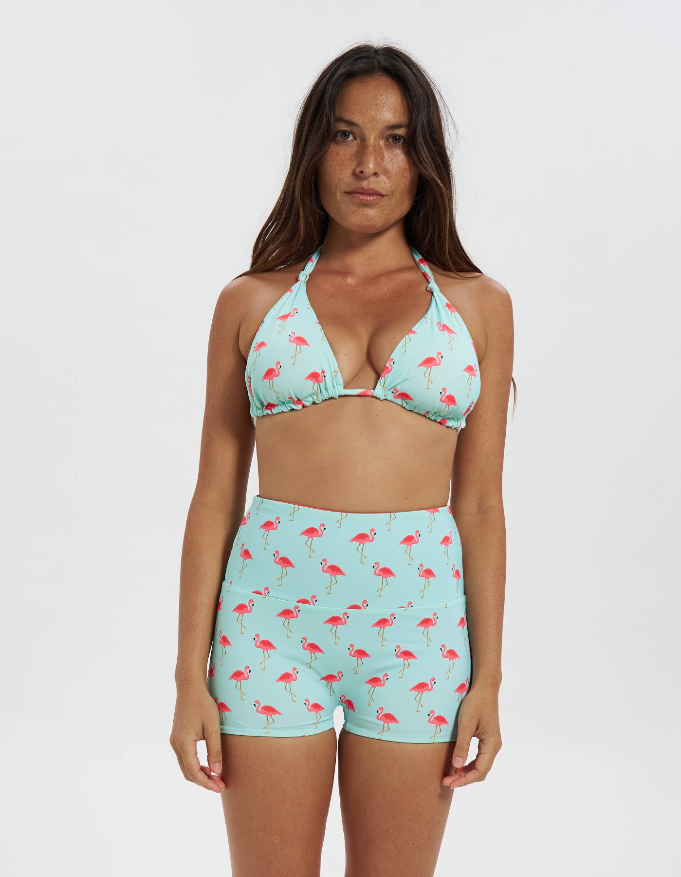 Pink Flamingo / Coral Womens Reversible Swim Shorts, front view. Sustainable womens swimwear.