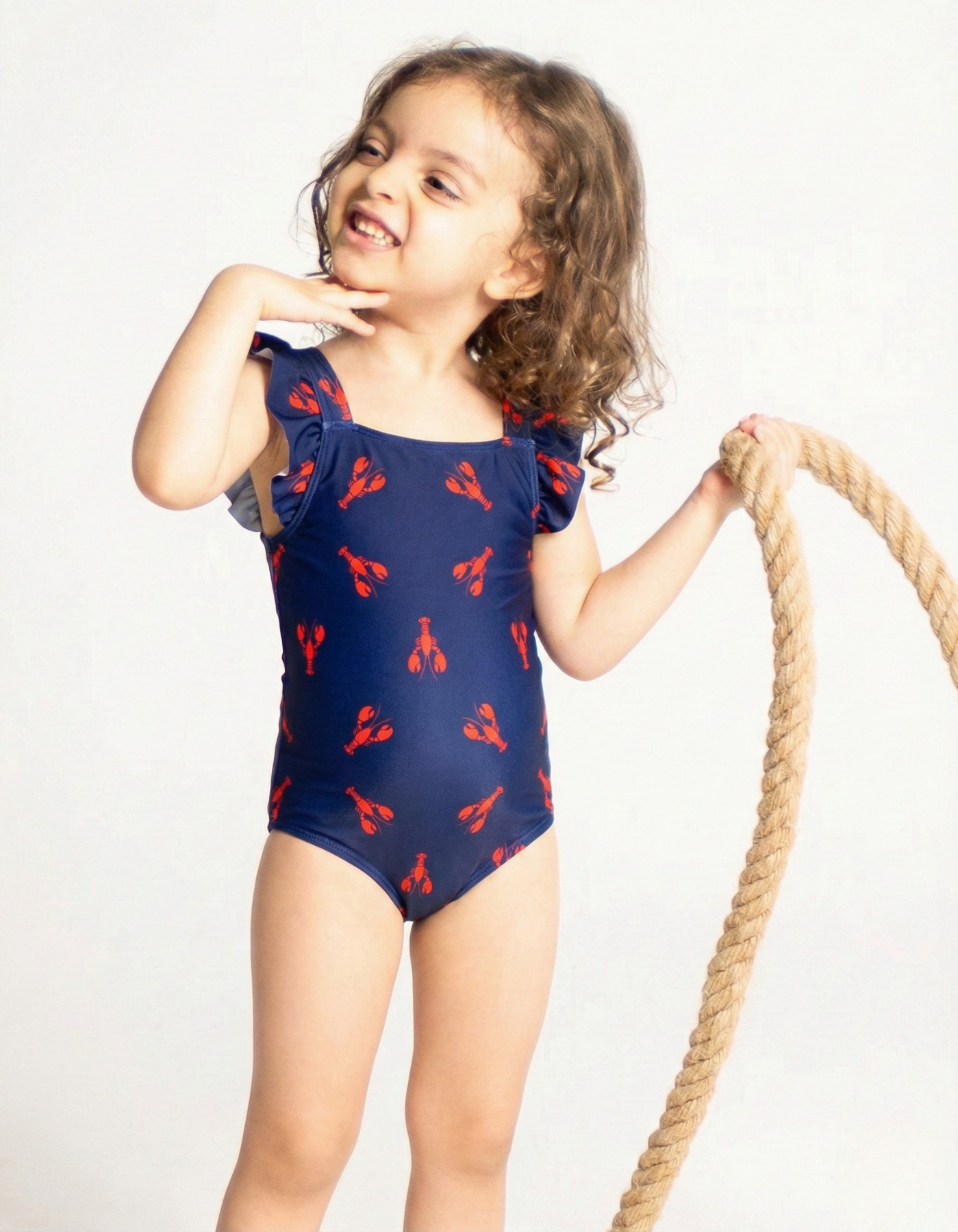 Red Lobster Girls Ruffle Swimsuit, front view. Sustainable girls swimwear.