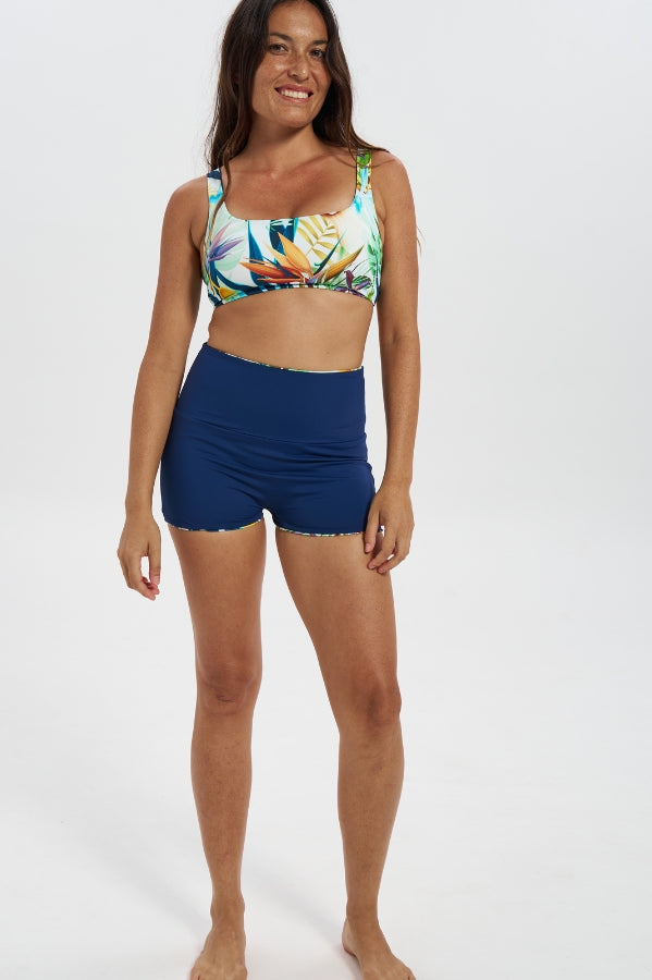 Bird of Paradise / Navy Womens Reversible Swim Shorts, front view. Sustainable womens swimwear.