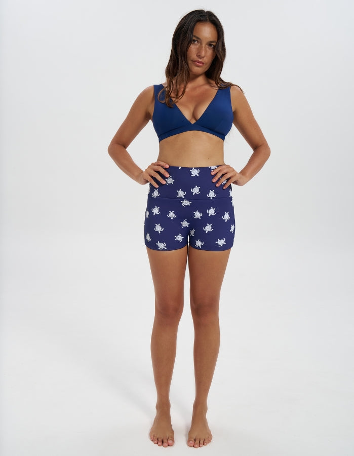Navy Turtle / Navy Womens Reversible Swim Shorts, front view. Sustainable womens swimwear.