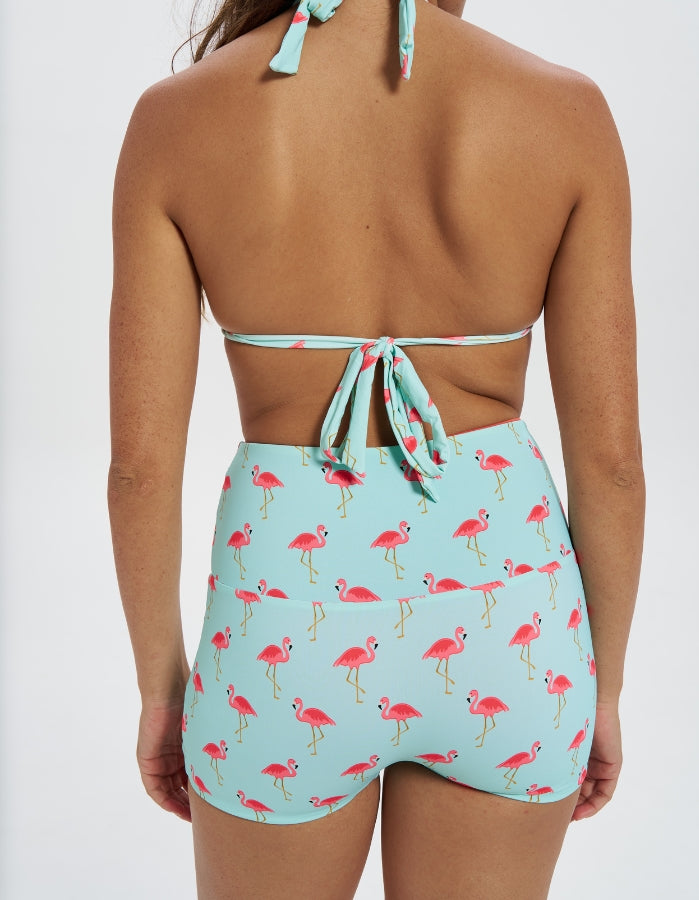 Pink Flamingo / Coral Womens Reversible Swim Shorts, back view. Sustainable womens swimwear.