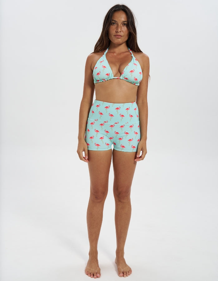 Pink Flamingo / Coral Womens Reversible Swim Shorts, front view. Sustainable womens swimwear.