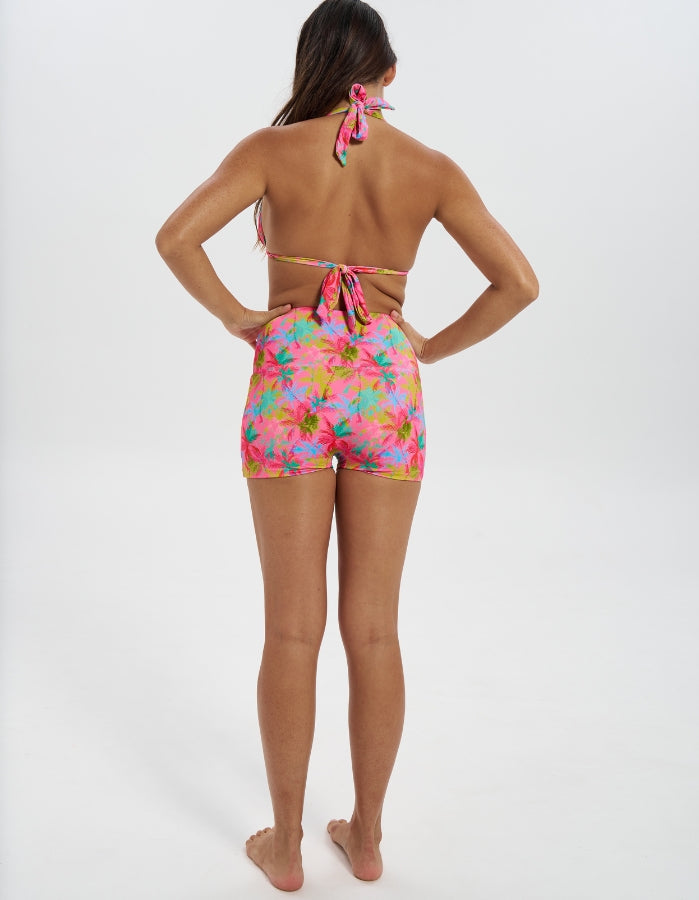 Pink Palm / Coral Womens Reversible Swim Shorts, back view. Sustainable womens swimwear.
