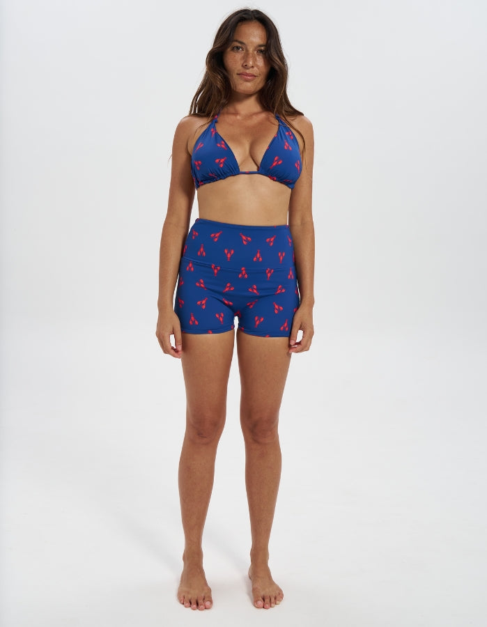 Lobster / Red Womens Reversible Swim Shorts, front view. Sustainable womens swimwear.