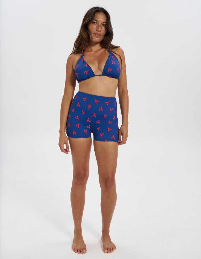 Lobster / Red Womens Reversible Swim Shorts, front view. Sustainable womens swimwear.
