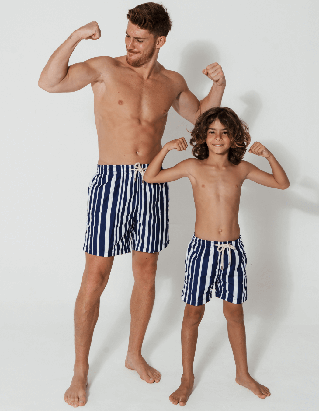 Blue & White Striped Mens Swim Shorts, back view. Sustainable mens swimwear.