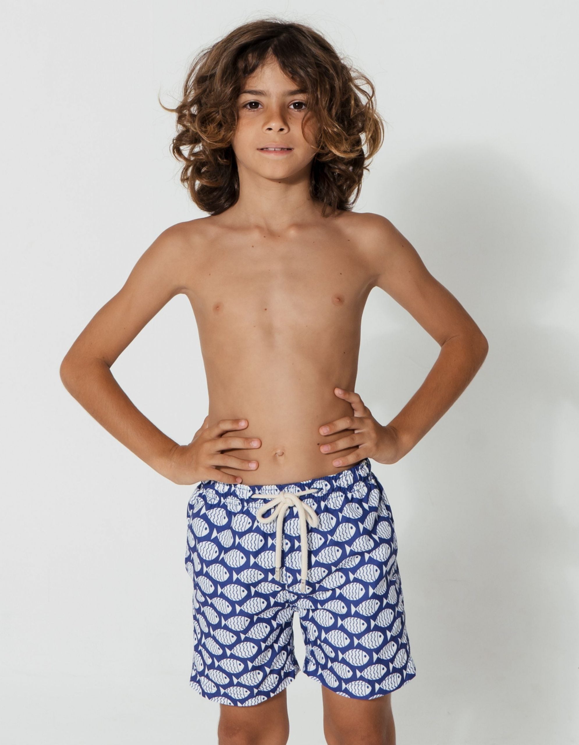 Blue Fish Boys Swim Shorts, front view. Sustainable boys swimwear.