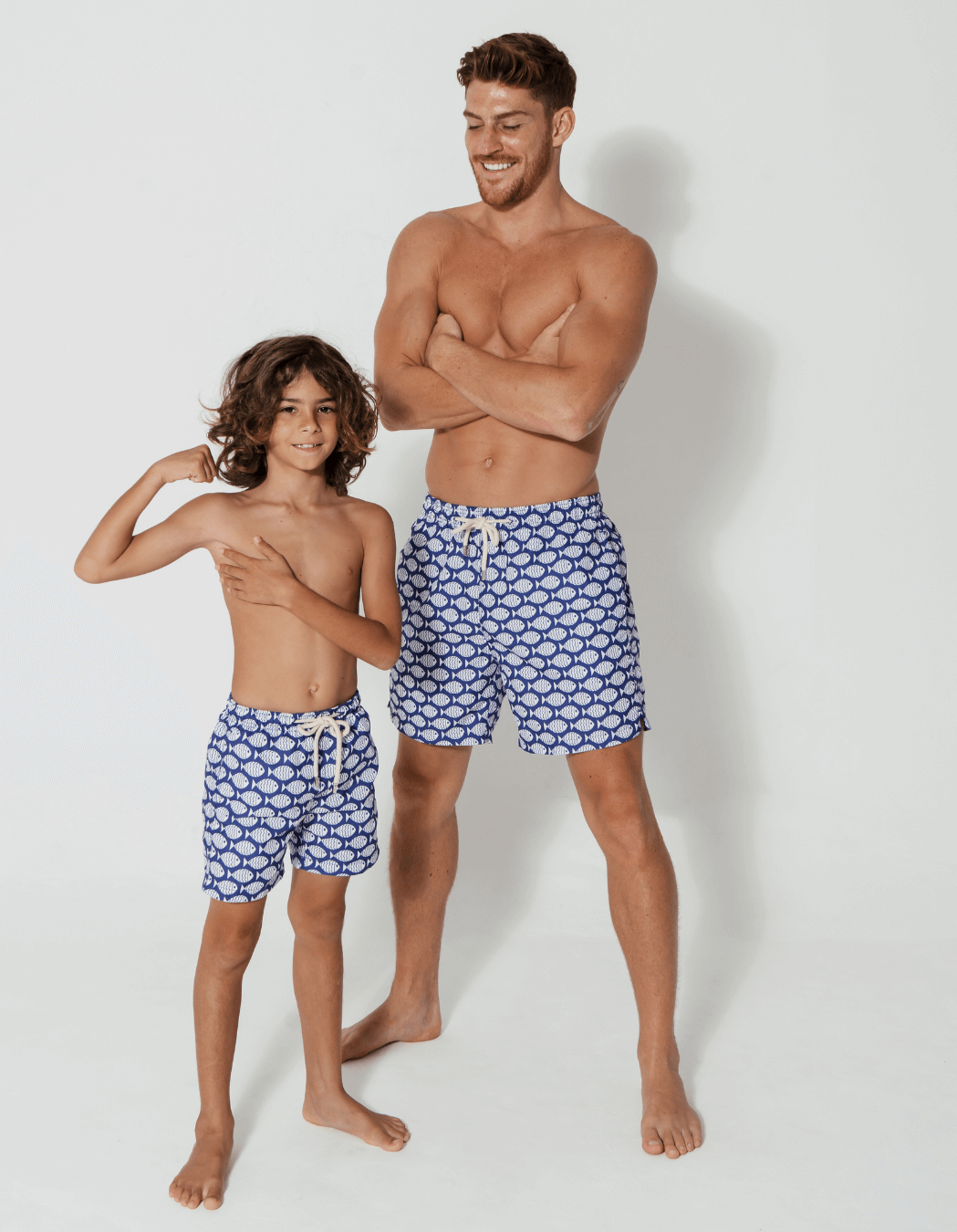 Blue Fish Mens Swim Shorts, back view. Sustainable mens swimwear.
