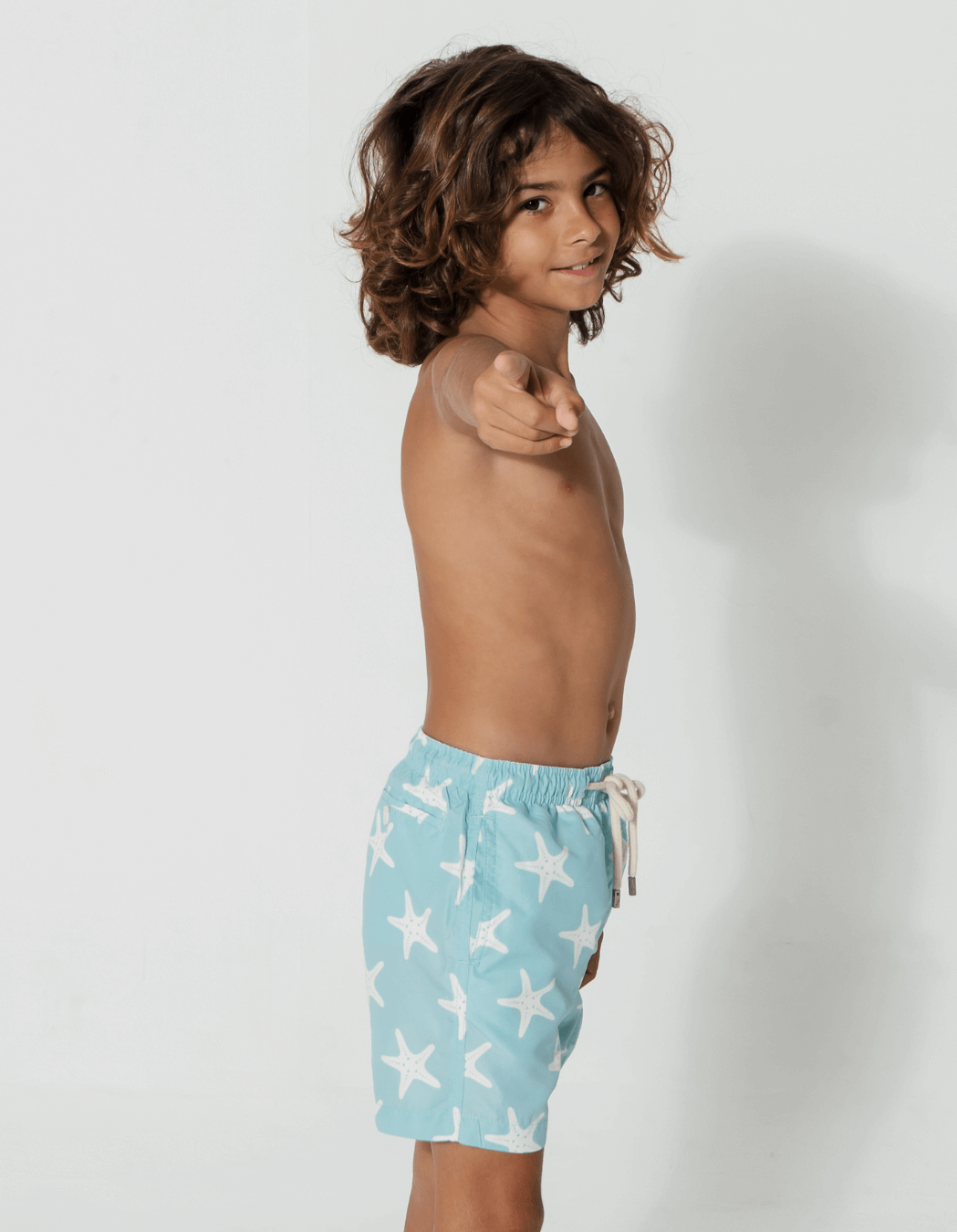 Blue Starfish Boys Swim Shorts, back view. Sustainable boys swimwear.
